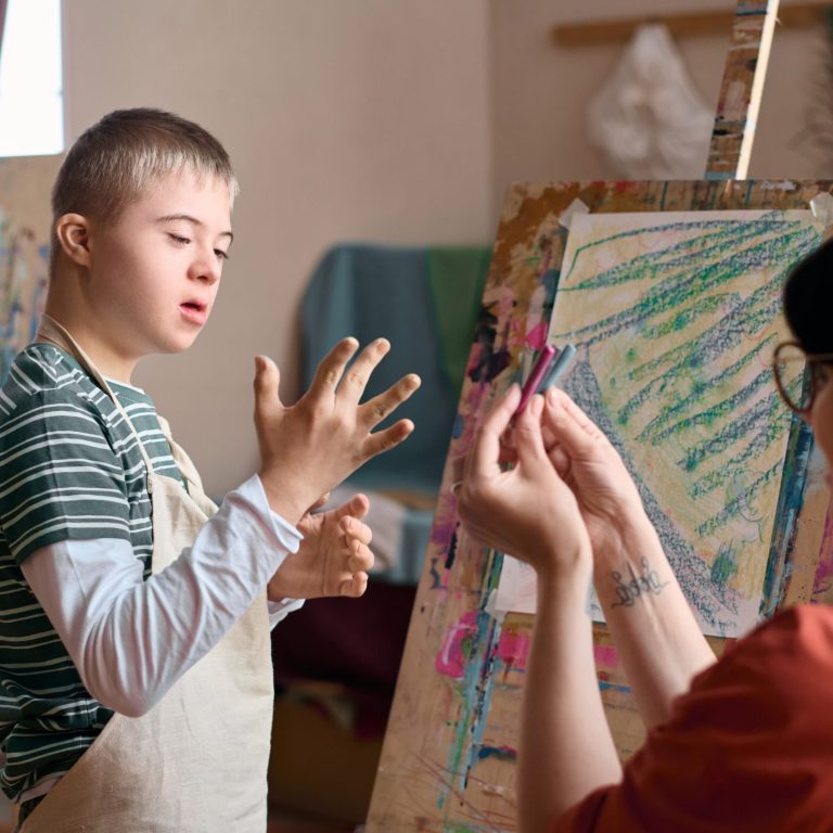 Boy with Down Syndrome Choosing Paint Colours. Portsmouth PBS Network.