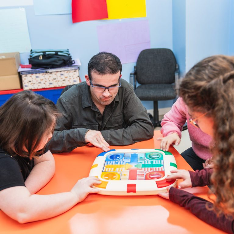 Members of the PBS community engaged in a learning game. Portsmouth PBS Network.